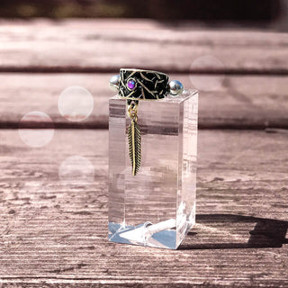 Manchette d'oreille Plume